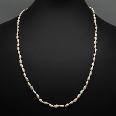 Lot 225 - A BAROQUE FRESHWATER PEARL SINGLE STRAND OPERA NECKLACE