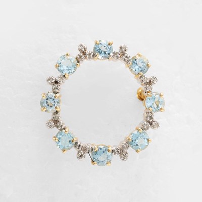 Lot 231 - A 9CT GOLD, BLUE TOPAZ AND DIAMOND SET BROOCH.