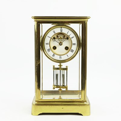 Lot 218 - A FRENCH FOUR GLASS GILT METAL MANTEL CLOCK