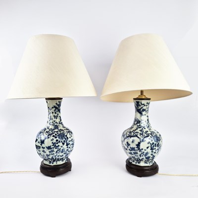 Lot 349 - PAIR OF CHINESE BLUE AND WHITE CERAMIC TABLE LAMPS WITH SHADES