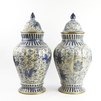 Lot 770 - BLUE AND WHITE CERAMIC TEMPLE JARS, A PAIR
