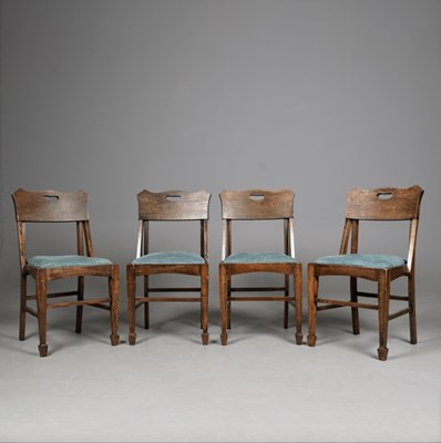 Lot 641 - SET OF FOUR EARLY 20th CENTURY OAK DINING CHAIRS IN THE MANNER OF ROBERT RIEMERSCHMID.